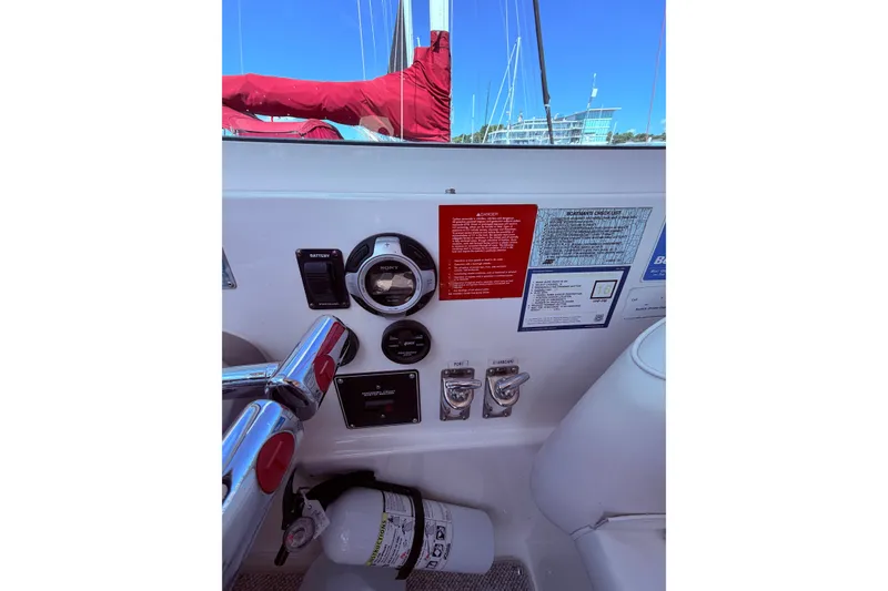 Slide: The Image of Control panel of a 2001 Cruisers Yachts 3870 Express with gauges and safety instructions. - 17