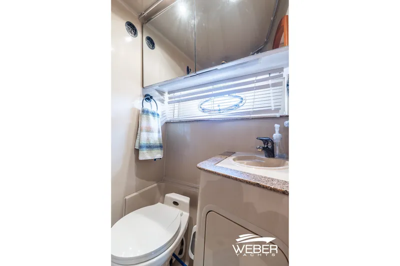 Slide: The Image of Bathroom interior of 2001 Cruisers Yachts 3870 Express with sink and toilet. - 39