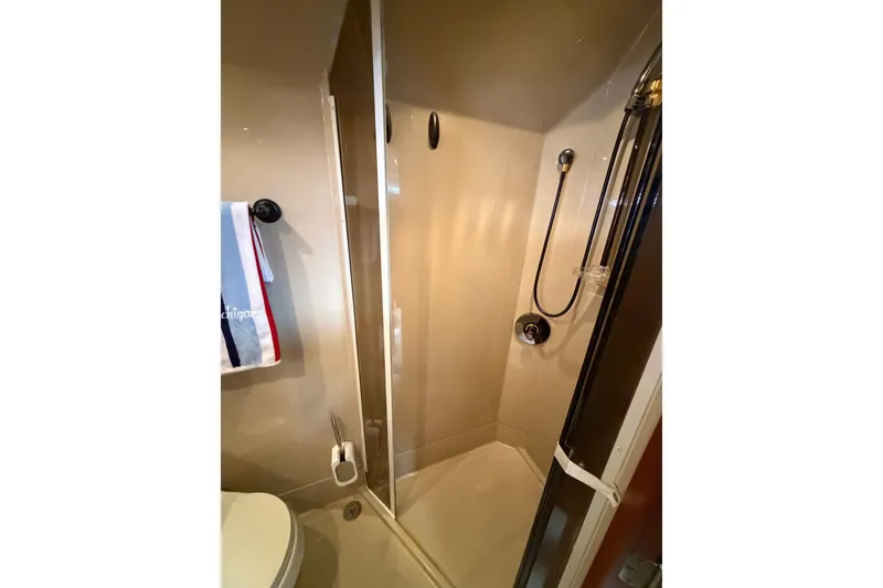 Slide: The Image of Shower area in 2001 Cruisers Yachts 3870 Express, featuring sleek design and modern fixtures. - 27