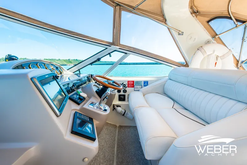 Slide: The Image of Luxurious interior of 2001 Cruisers Yachts 3870 Express with plush seating and modern controls. - 27