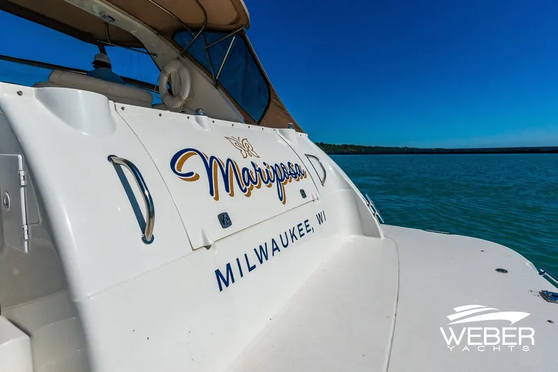 Slide: The Image of 2001 Cruisers Yachts 3870 Express on water, Milwaukee, WI, sunny day. - 14