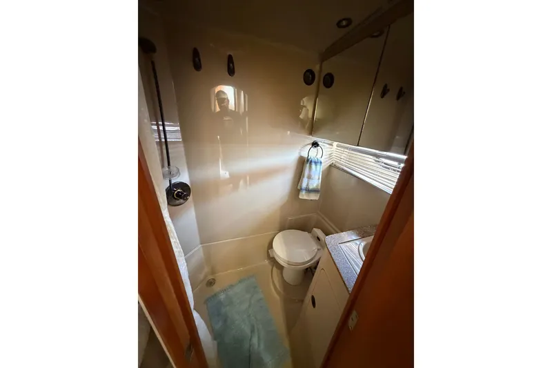 Slide: The Image of Bathroom interior of 2001 Cruisers Yachts 3870 Express with shower and sink. - 26