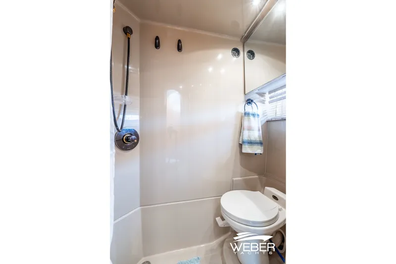 Slide: The Image of Bathroom interior of 2001 Cruisers Yachts 3870 Express with shower and toilet. - 38