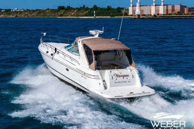 Slide: The Image of 2001 Cruisers Yachts 3870 Express cruising on blue waters near Milwaukee. - 6