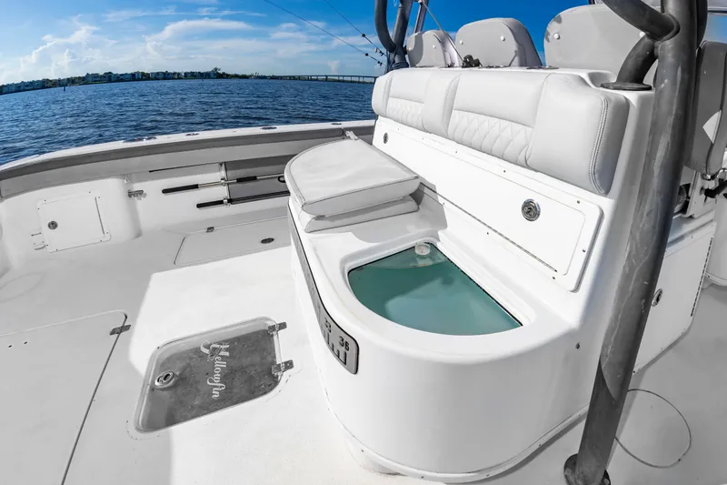 Slide: The Image of The image shows the deck of a 2015 Yellowfin 39 Offshore boat with seating and a livewell. - 34