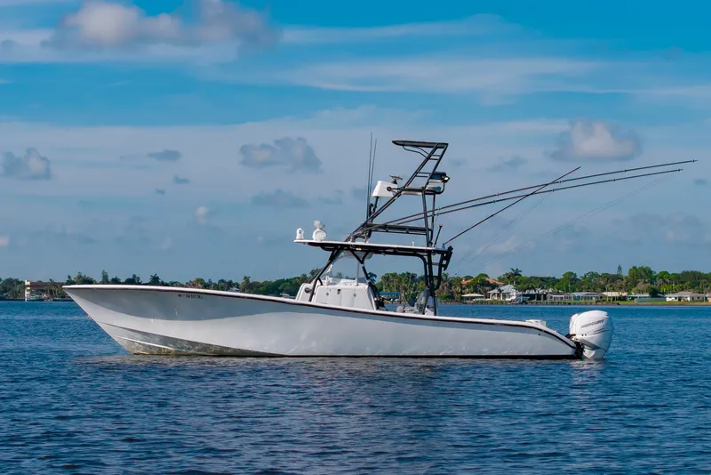 Slide: The Image of A 2015 Yellowfin 39 Offshore boat on calm water with a clear sky in the background. - 4