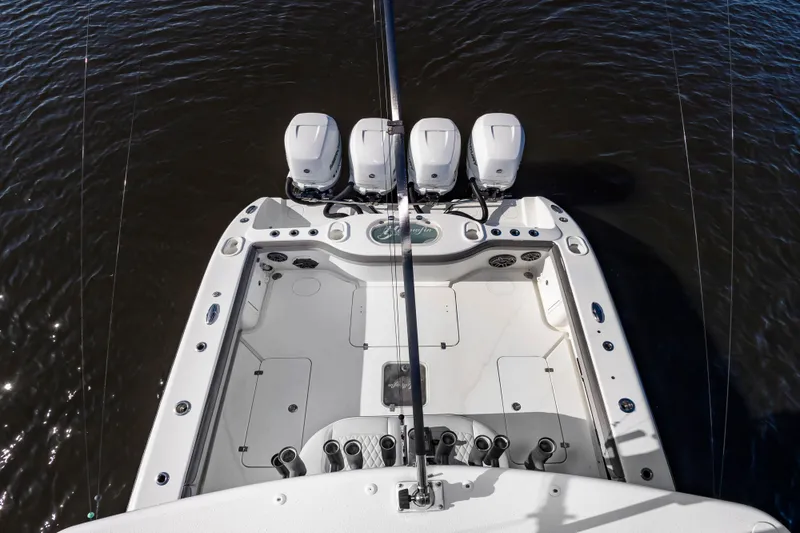 Slide: The Image of Overhead view of a 2015 Yellowfin 39 Offshore with four outboard engines on calm water. - 28