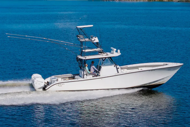 Slide: The Image of A 2015 Yellowfin 39 Offshore boat speeds across the blue water. - 6