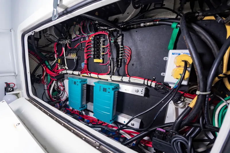 Slide: The Image of Electrical system of a 2015 Yellowfin 39 Offshore with cables and circuit boxes. - 20