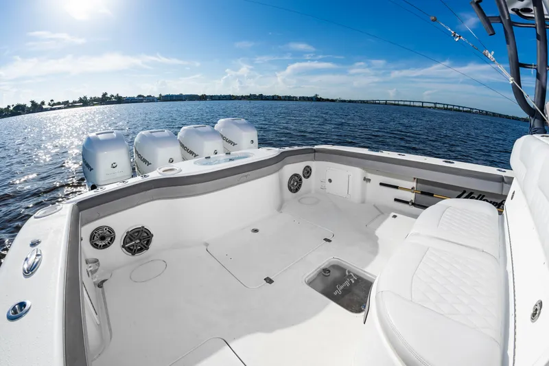 Slide: The Image of The image shows the stern of a 2015 Yellowfin 39 Offshore boat on the water. - 31