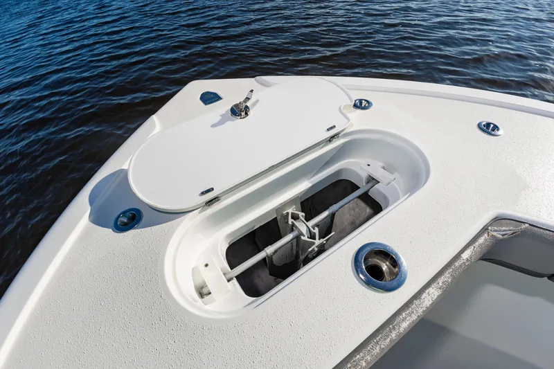 Slide: The Image of An anchor compartment on a 2015 Yellowfin 39 Offshore boat, surrounded by blue water. - 9