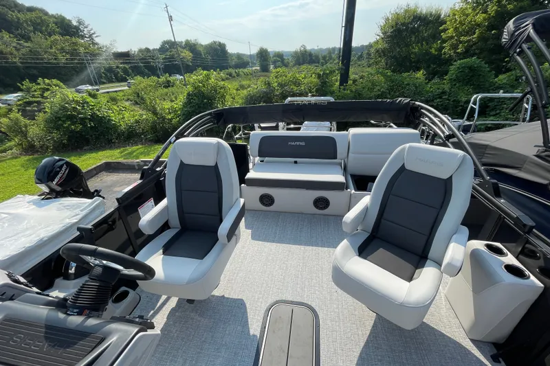 Slide: The Image of 2026 Harris Cruiser 210 SLDH pontoon boat interior with plush seating and modern design. - 10