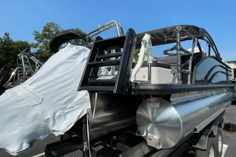 Slide: The Image of 2026 Harris Cruiser 210 SLDH pontoon boat with sleek design and modern features. - 17