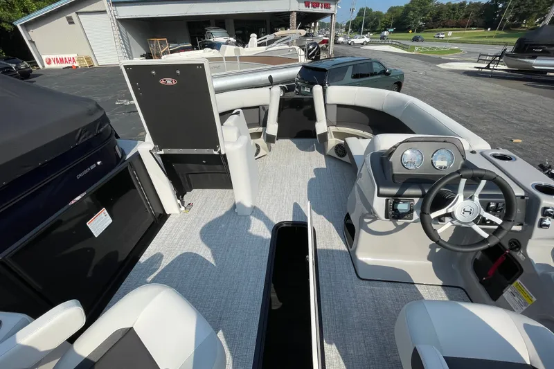 Slide: The Image of 2026 Harris Cruiser 210 SLDH pontoon boat interior with modern helm and seating. - 11