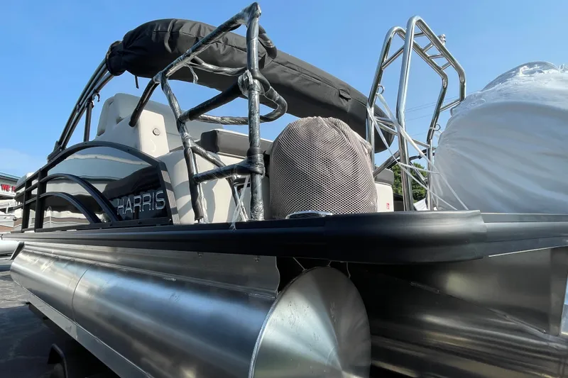 Slide: The Image of 2026 Harris Cruiser 210 SLDH pontoon boat with sleek design and modern features. - 16