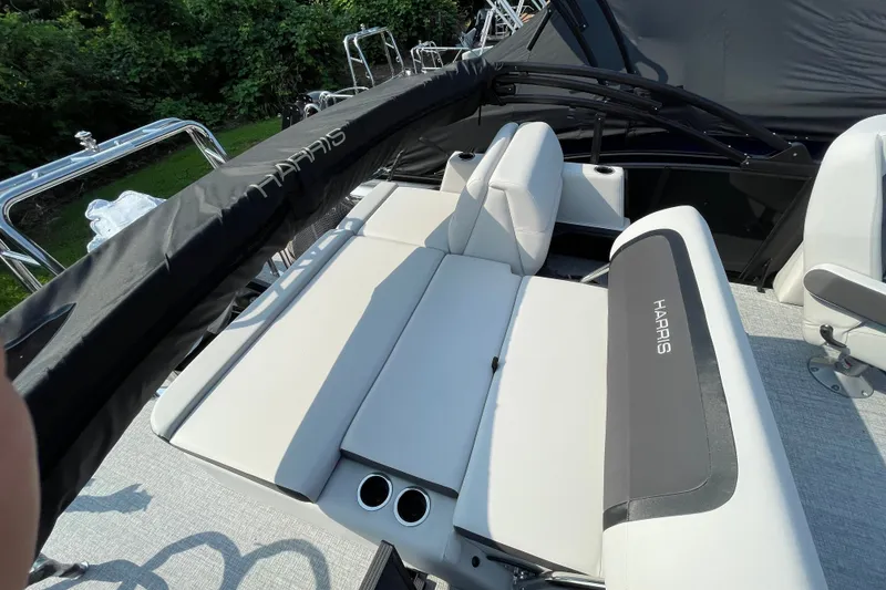 Slide: The Image of 2026 Harris Cruiser 210 SLDH boat interior with plush seating and sleek design. - 4