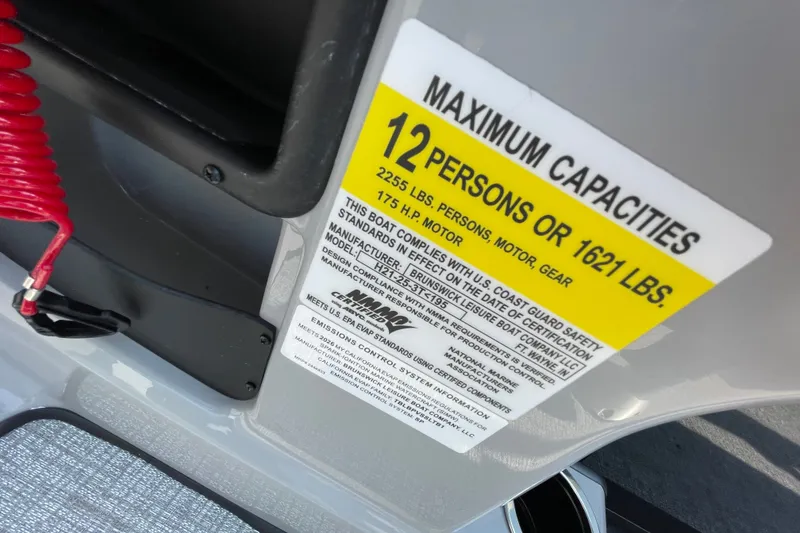 Slide: The Image of Capacity label on 2026 Harris Cruiser 210 SLDH, indicating 12 persons or 1621 lbs limit. - 13