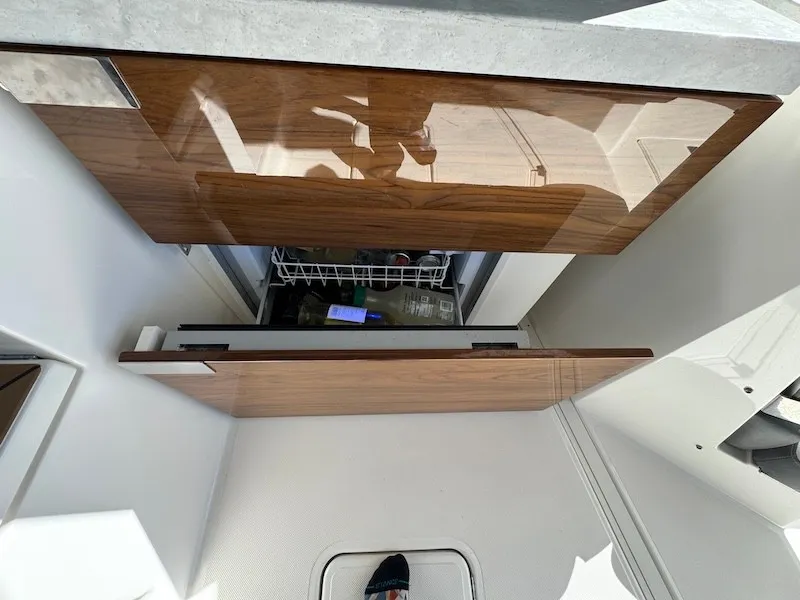 Slide: The Image of An open refrigerator with wooden doors in a modern yacht kitchen. - 40