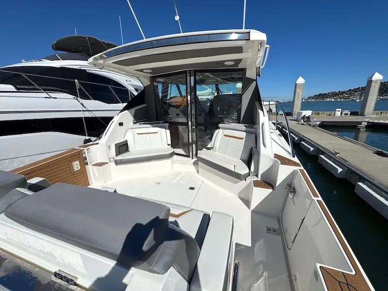 Slide: The Image of The image shows the cockpit of a 2022 Tiara Yachts 43 LE with sleek seating and modern design. - 14