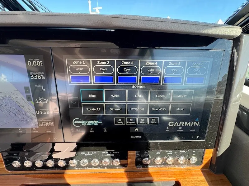 Slide: The Image of The image shows a modern Garmin control panel on a 2022 Tiara Yachts 43 LE. - 21