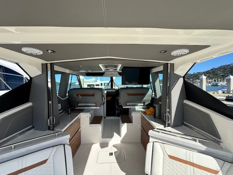 Slide: The Image of Interior of a 2022 Tiara Yachts 43 LE with modern seating and sleek details. - 48