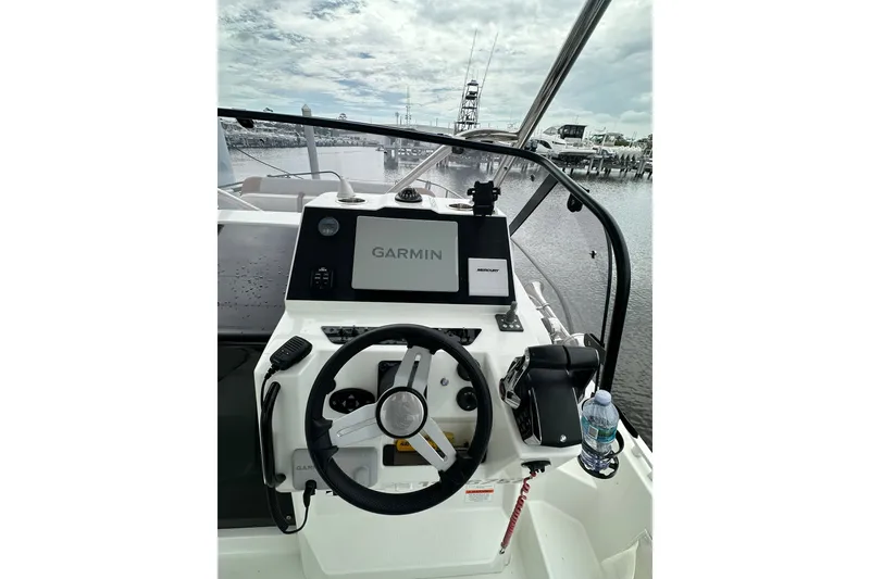 Slide: The Image of 2024 Beneteau Flyer 9 SUNdeck helm with Garmin navigation system, docked at marina. - 16