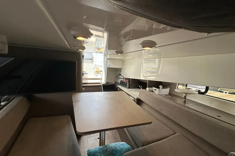 Slide: The Image of Interior of 2024 Beneteau Flyer 9 SUNdeck, featuring cozy seating and modern amenities. - 33