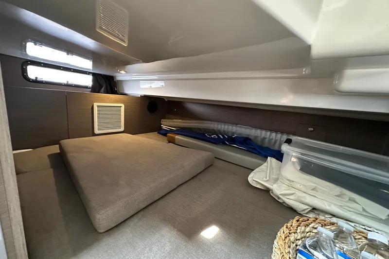 Slide: The Image of 2024 Beneteau Flyer 9 SUNdeck cabin interior with cozy bedding and storage space. - 21
