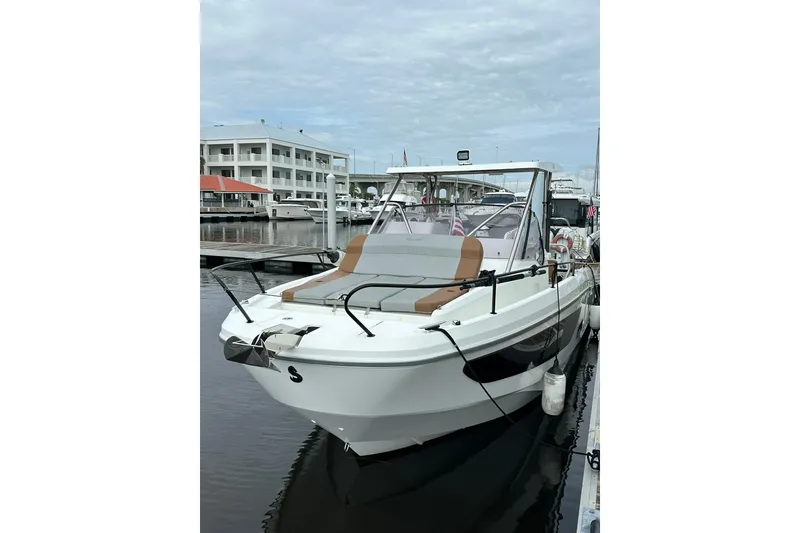 Slide: The Image of 2024 Beneteau Flyer 9 SUNdeck boat docked at marina, showcasing sleek design. - 15