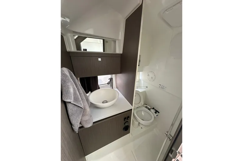 Slide: The Image of 2024 Beneteau Flyer 9 SUNdeck bathroom with modern sink and toilet. - 26