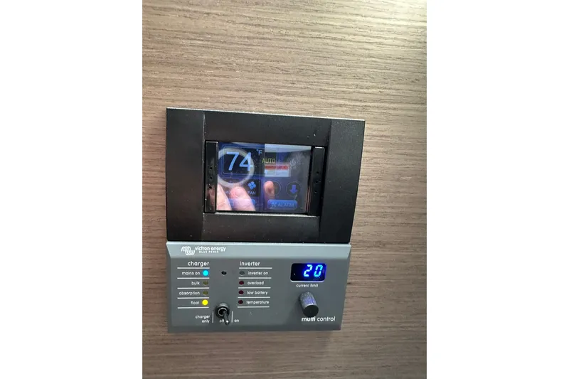 Slide: The Image of Control panel on 2024 Beneteau Flyer 9 SUNdeck, displaying temperature and inverter settings. - 23