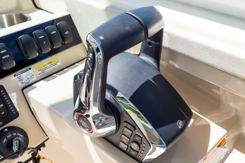 Slide: The Image of Throttle control panel on a 2023 Boston Whaler 280 Vantage boat. - 15