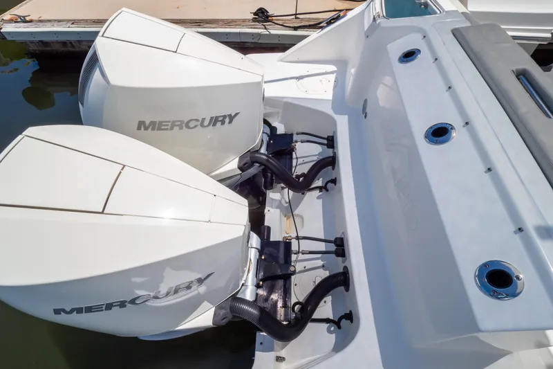 Slide: The Image of 2023 Boston Whaler 280 Vantage with dual Mercury outboard engines at dock. - 32