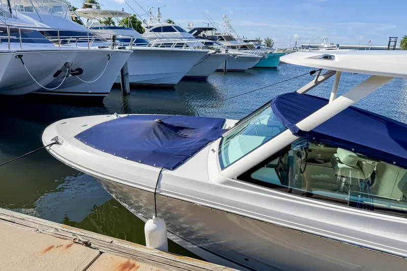 Slide: The Image of 2023 Boston Whaler 280 Vantage docked among luxury boats in marina. - 101
