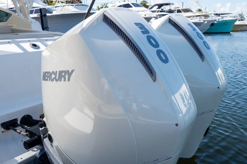 Slide: The Image of Twin Mercury outboard engines on a 2023 Boston Whaler 280 Vantage boat. - 78