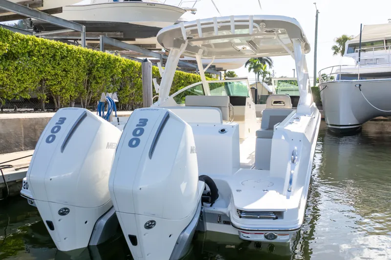 Slide: The Image of 2023 Boston Whaler 280 Vantage boat with twin 300 horsepower engines docked. - 29