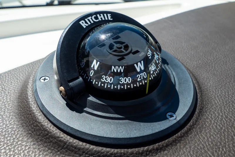 Slide: The Image of Compass on 2023 Boston Whaler 280 Vantage boat dashboard, featuring Ritchie navigation. - 16