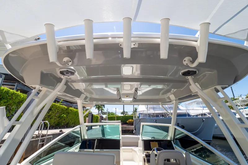 Slide: The Image of 2023 Boston Whaler 280 Vantage boat interior, showcasing helm and hardtop design. - 58