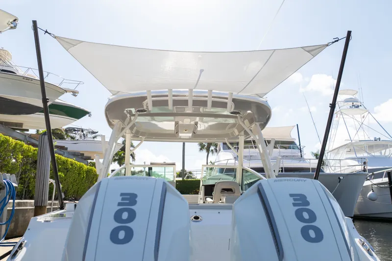 Slide: The Image of 2023 Boston Whaler 280 Vantage with dual Mercury 300 engines docked at marina. - 24