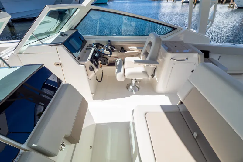 Slide: The Image of Interior view of 2023 Boston Whaler 280 Vantage boat, featuring helm and seating area. - 73