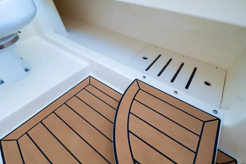 Slide: The Image of 2023 Boston Whaler 280 Vantage boat interior with teak-style flooring detail. - 85