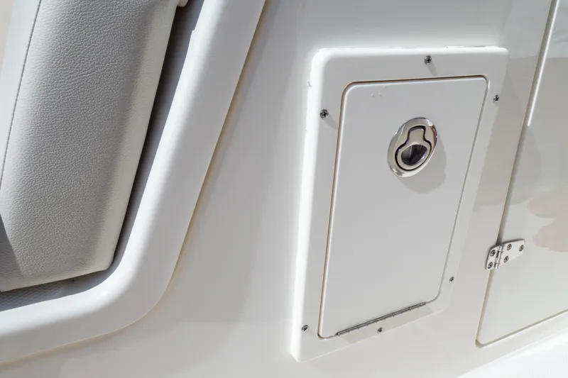 Slide: The Image of 2023 Boston Whaler 280 Vantage boat compartment with sleek design and secure latch. - 88