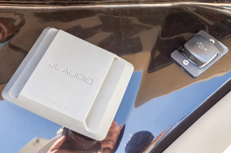 Slide: The Image of JL Audio MediaMaster on 2023 Boston Whaler 280 Vantage dashboard. - 89
