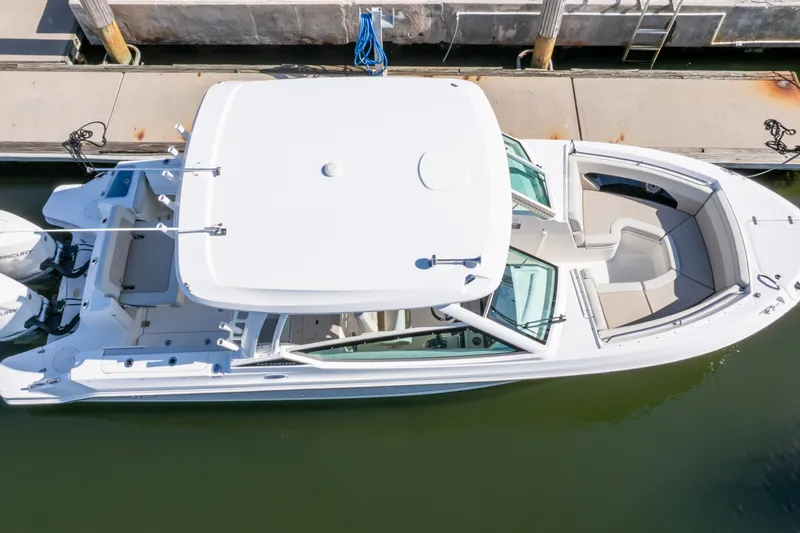 Slide: The Image of Top view of a 2023 Boston Whaler 280 Vantage docked at a marina. - 27