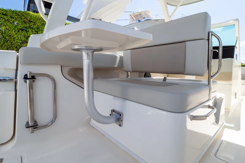 Slide: The Image of 2023 Boston Whaler 280 Vantage interior seating with table, showcasing luxury and comfort. - 68