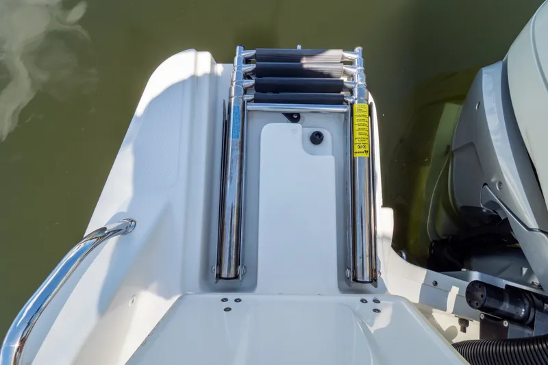 Slide: The Image of 2023 Boston Whaler 280 Vantage swim platform with ladder and motor detail. - 36