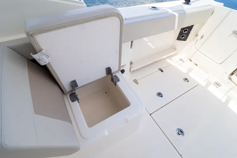 Slide: The Image of 2023 Boston Whaler 280 Vantage boat interior with open storage compartment. - 46