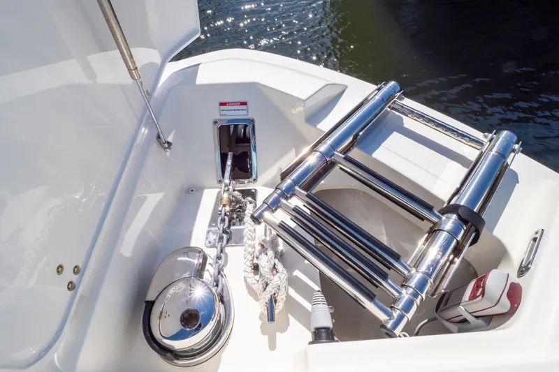 Slide: The Image of 2023 Boston Whaler 280 Vantage boat deck with stainless steel ladder and anchor chain. - 98