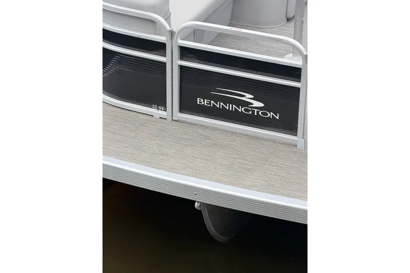 Slide: The Image of 2023 Bennington 22 SV pontoon boat deck with logo and railing. - 23