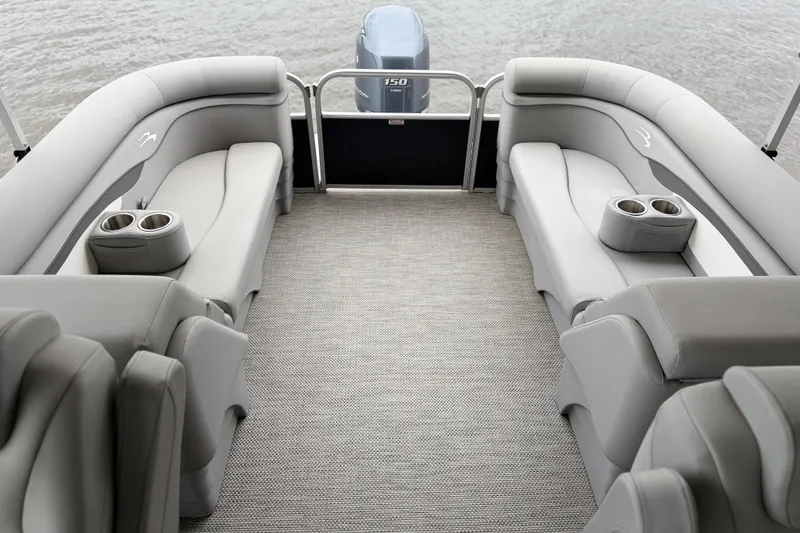 Slide: The Image of 2023 Bennington 22 SV pontoon boat interior with plush seating and cup holders. - 14